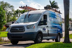 Mechanical Air Conditioning service van parked in a neighborhood for AC replacement service.